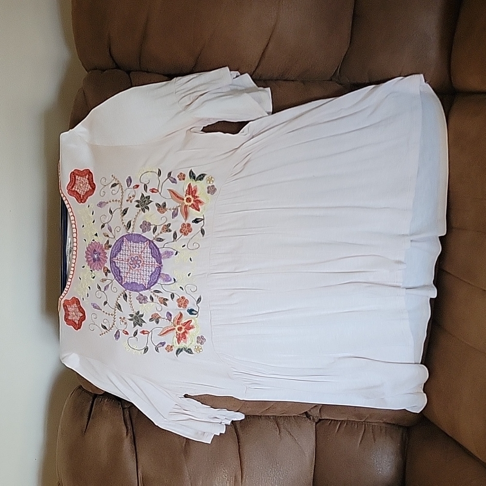 Cream Tunic top with flower's embroidered across the front